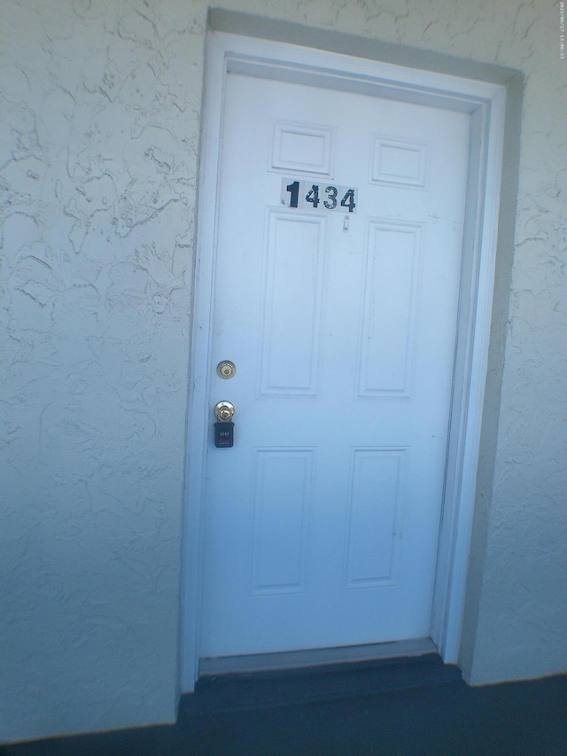 9872 Marina Blvd Unit 1434, Boca Raton, FL 33433 - doorway to property with stucco siding