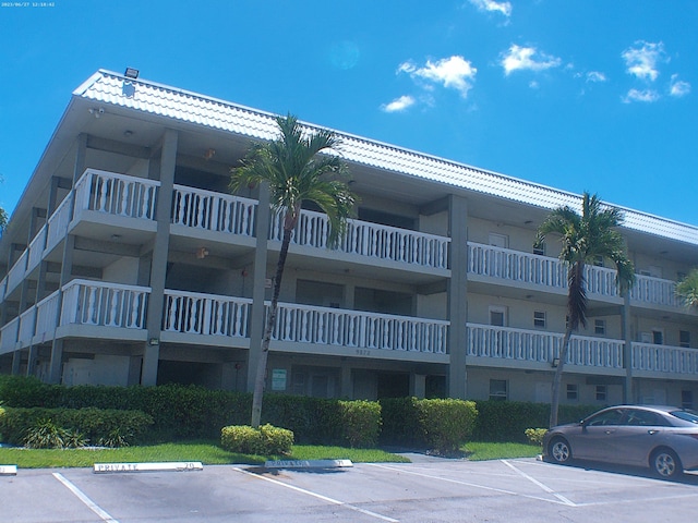 9872 Marina Blvd Unit 1434, Boca Raton, FL 33433 - view of apartment building / complex featuring uncovered parking