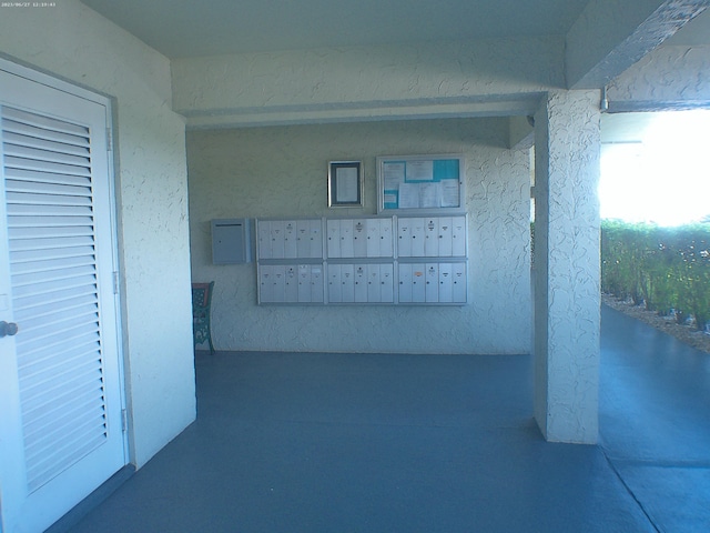 corridor featuring a mail area