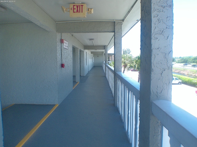 hall featuring concrete floors