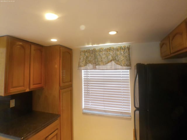 kitchen featuring black fridge