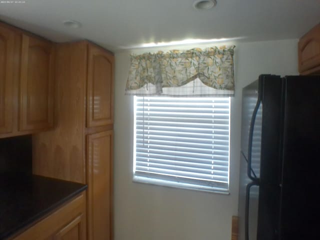 kitchen featuring black fridge