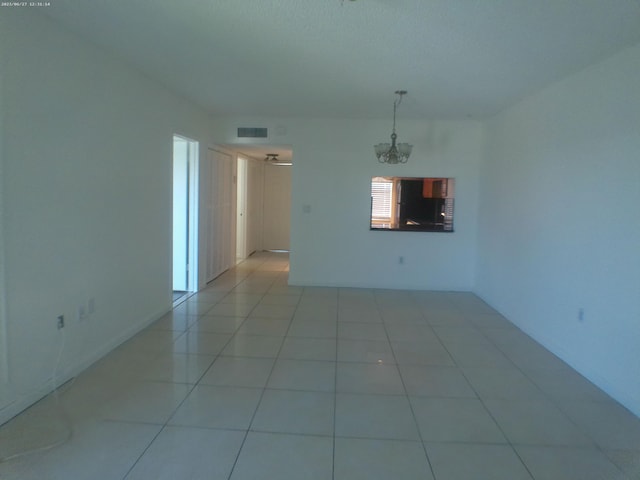 9872 Marina Blvd Unit 1434, Boca Raton, FL 33433 - spare room with a chandelier and light tile patterned floors