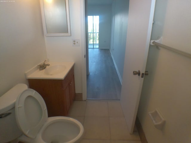 bathroom with tile patterned floors, toilet, and vanity