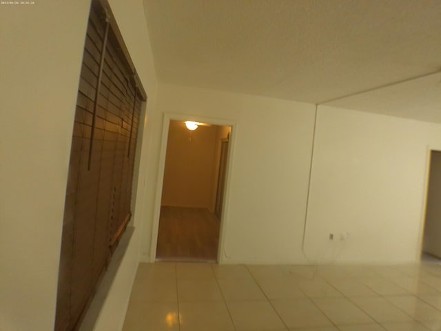 hallway featuring light tile patterned flooring