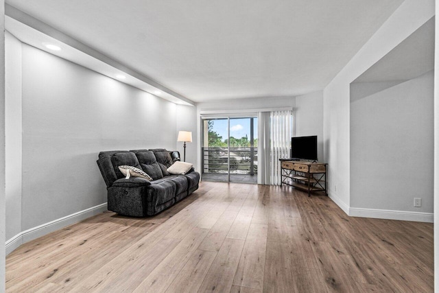 living area with hardwood / wood-style floors