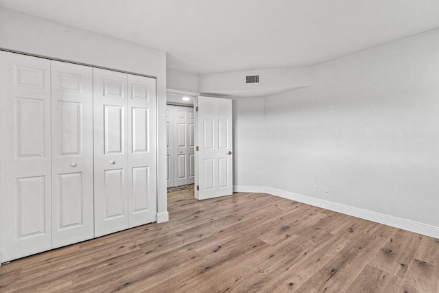 unfurnished bedroom featuring light hardwood / wood-style flooring