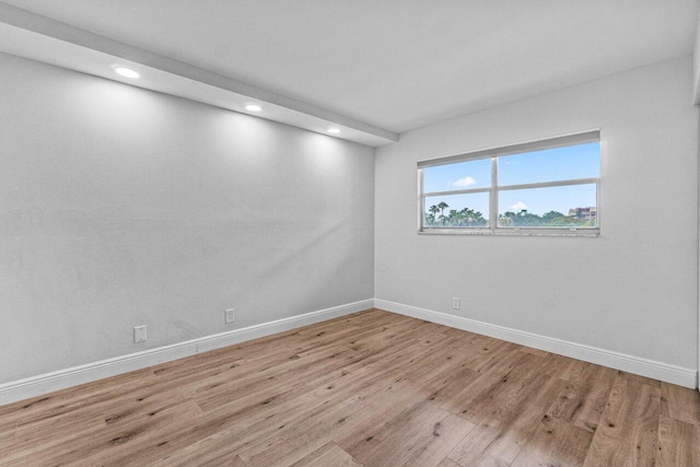 spare room featuring light wood-type flooring