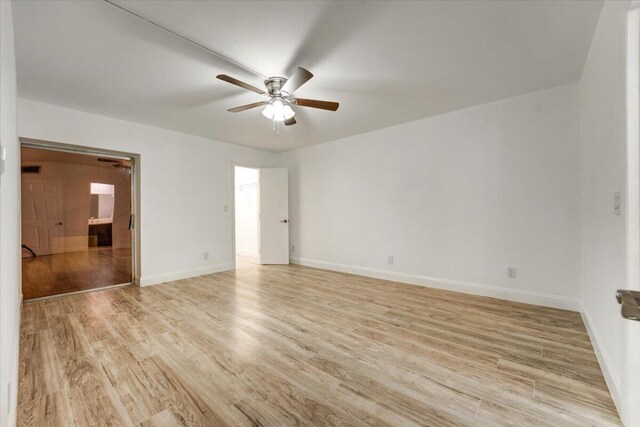 3601 Inverrary Dr Unit 102, Lauderhill, FL 33319 - spare room with light wood-style floors, ceiling fan, and baseboards