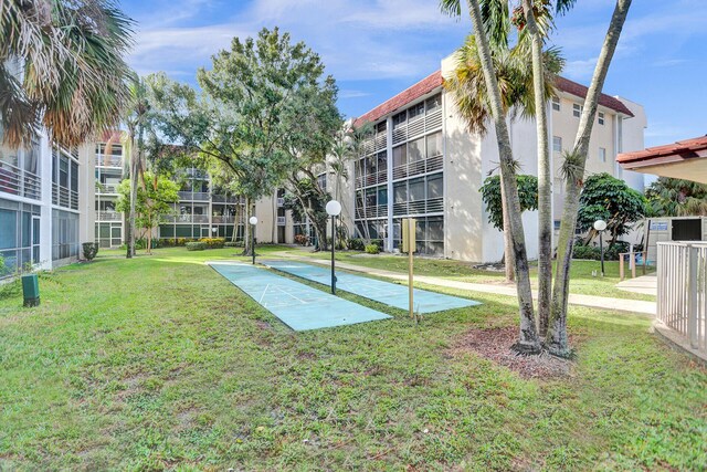 3601 Inverrary Dr Unit 102, Lauderhill, FL 33319 - view of community featuring shuffleboard and a yard