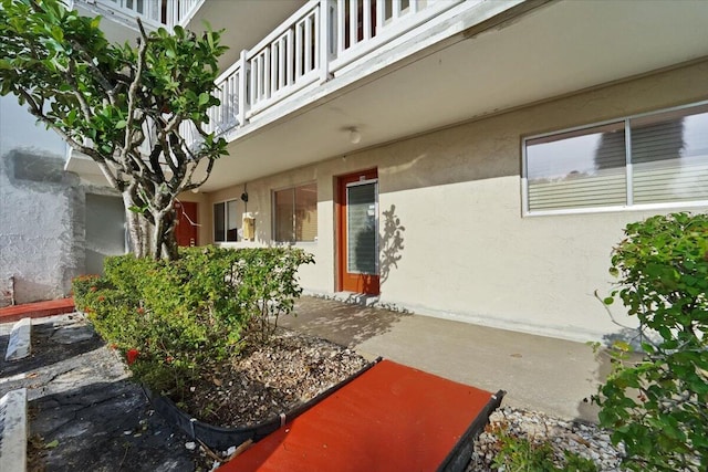 3601 Inverrary Dr Unit 102, Lauderhill, FL 33319 - doorway to property with a balcony and stucco siding