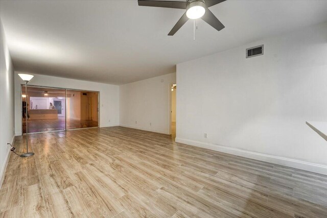 3601 Inverrary Dr Unit 102, Lauderhill, FL 33319 - spare room featuring wood finished floors, ceiling fan, and baseboards