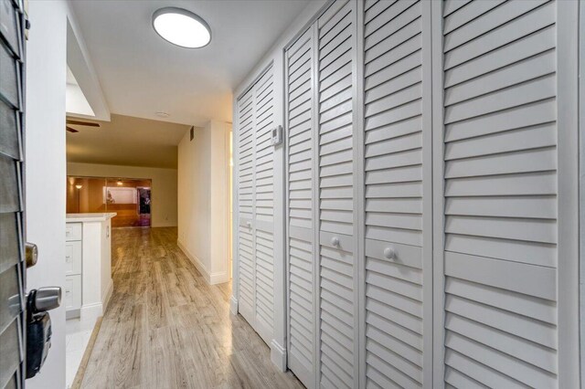 3601 Inverrary Dr Unit 102, Lauderhill, FL 33319 - corridor featuring light wood-style floors and baseboards