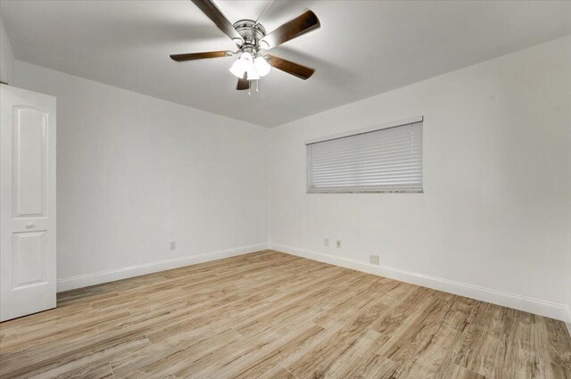 3601 Inverrary Dr Unit 102, Lauderhill, FL 33319 - empty room with light wood-style flooring, baseboards, and a ceiling fan