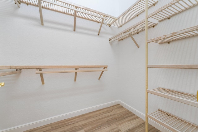 walk in closet featuring hardwood / wood-style floors