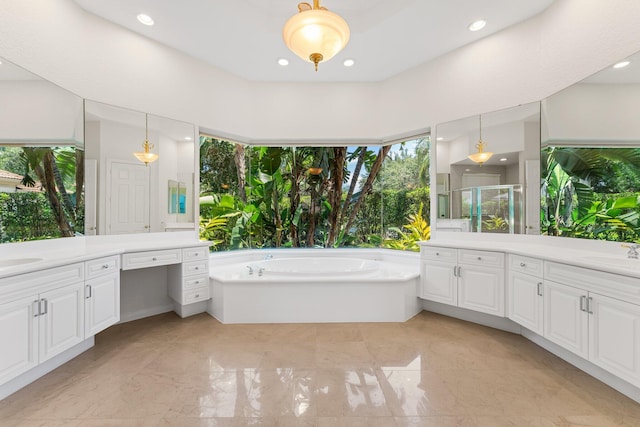 bathroom featuring vanity and plus walk in shower