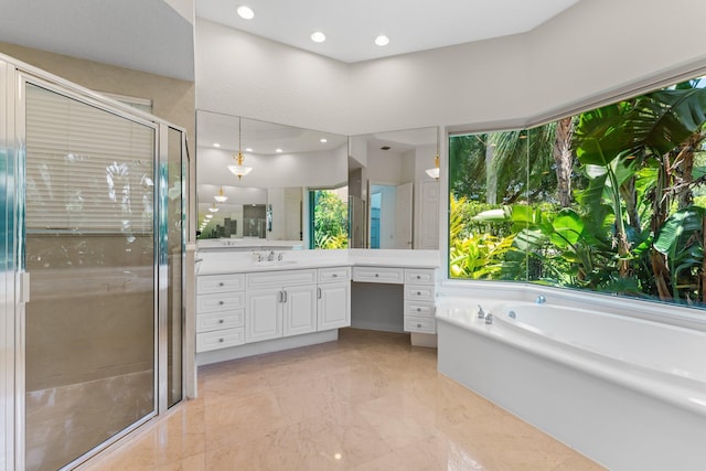 bathroom featuring a wealth of natural light, vanity, and shower with separate bathtub