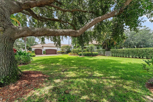 view of yard featuring a garage