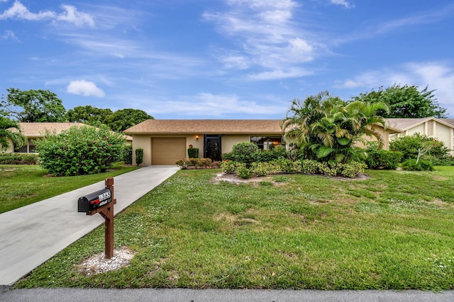 single story home featuring a front yard and a garage