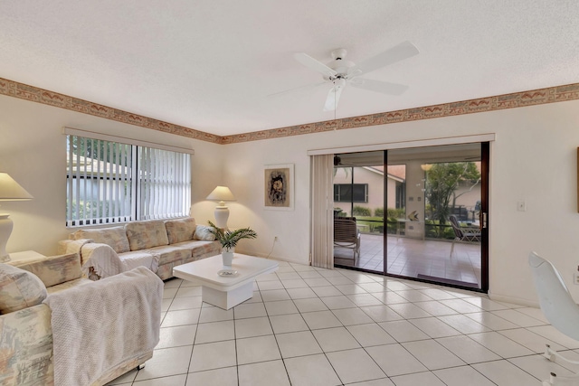 living room featuring light tile patterned floors and ceiling fan