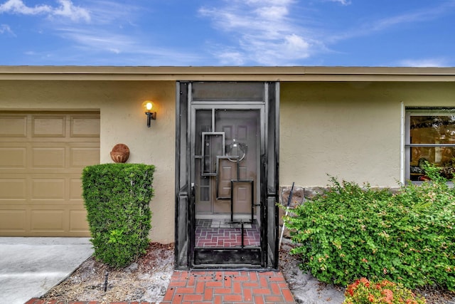 entrance to property featuring a garage