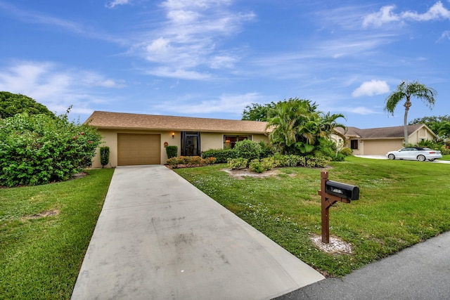 single story home with a garage and a front lawn