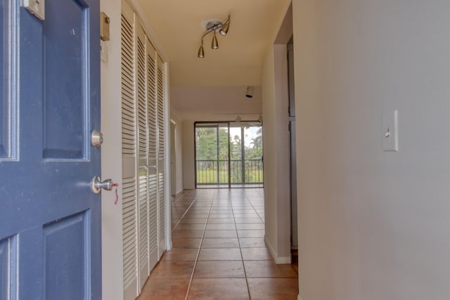 corridor featuring light tile patterned floors