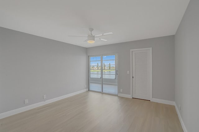 unfurnished room with light wood-type flooring and ceiling fan