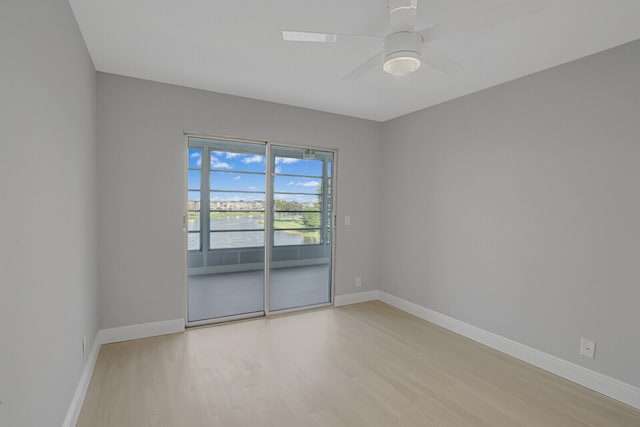 spare room featuring ceiling fan and light hardwood / wood-style floors