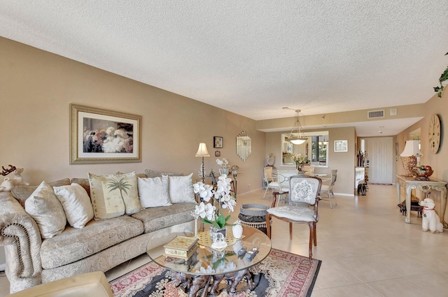 tiled living room with a textured ceiling