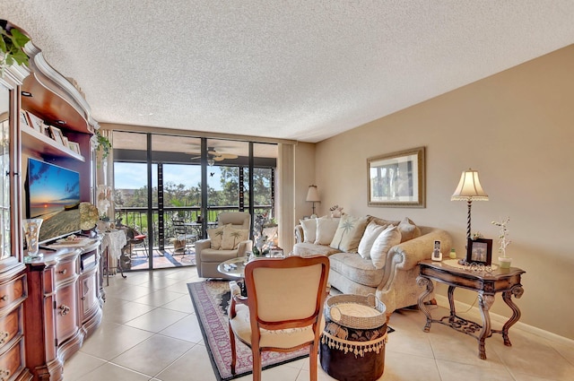 living room featuring light tile patterned floors, expansive windows, and a textured ceiling