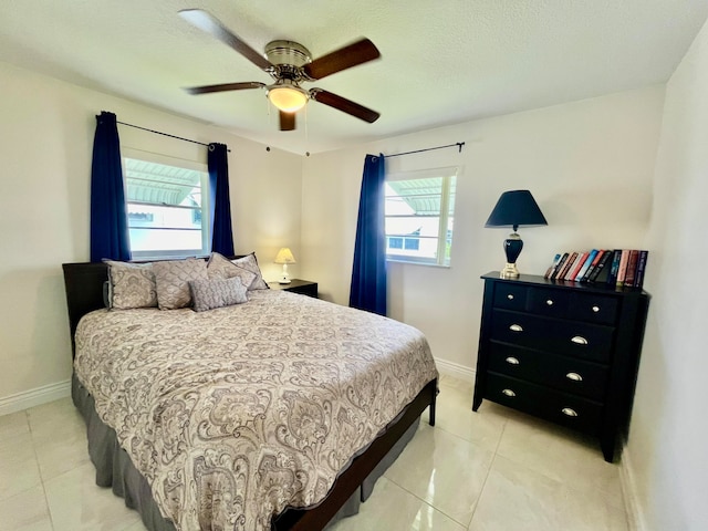 tiled bedroom with ceiling fan