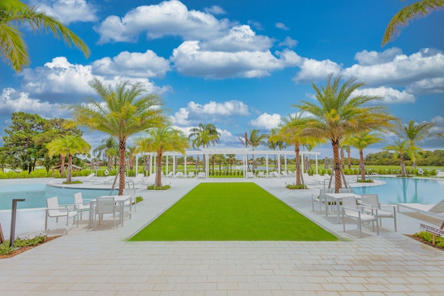 view of home's community with a patio area