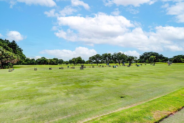 view of home's community with a lawn and a rural view