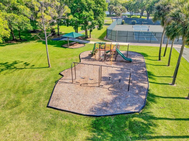 exterior space with a playground and a yard