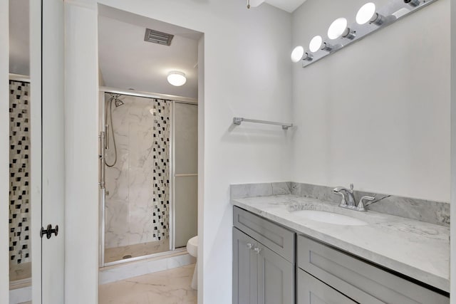 bathroom with walk in shower, tile patterned floors, toilet, and vanity