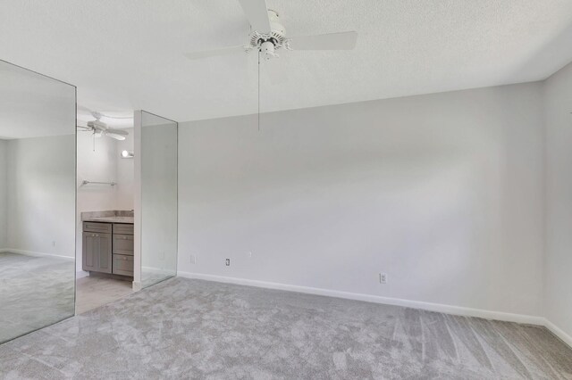 unfurnished room featuring light tile patterned floors and a textured ceiling