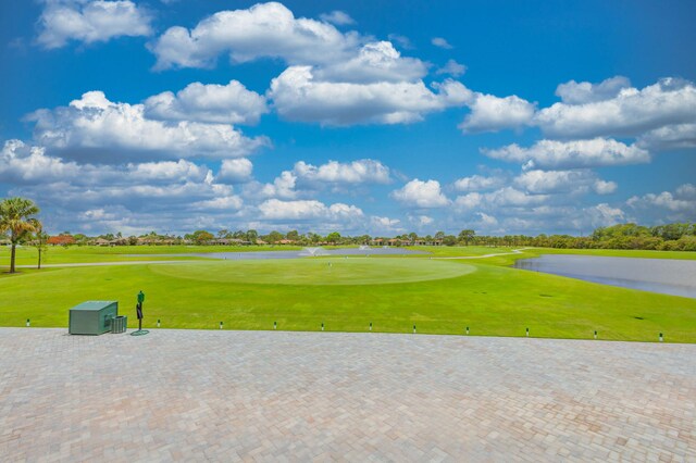 view of property's community featuring a lawn