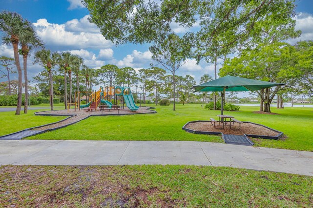 view of jungle gym with a lawn