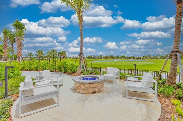 view of patio with a fire pit