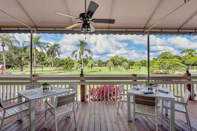 wooden deck featuring ceiling fan