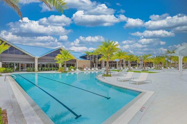 view of swimming pool with a patio area