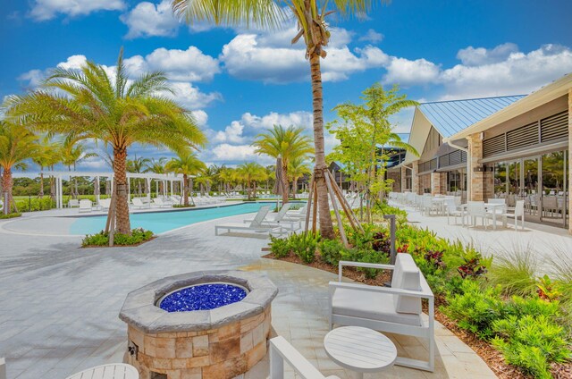 exterior space with a patio and an outdoor fire pit