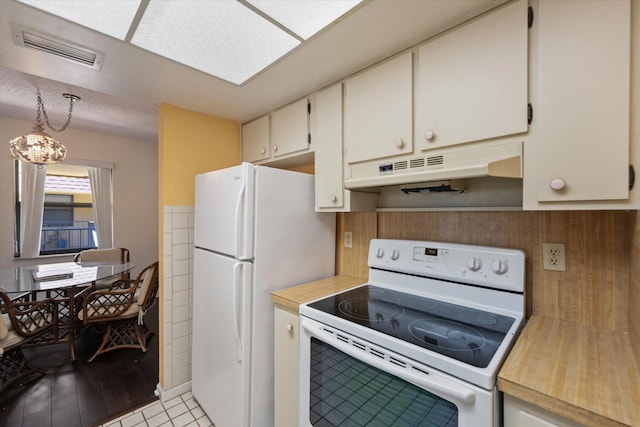 kitchen with white cabinetry, white appliances, and light wood-type flooring