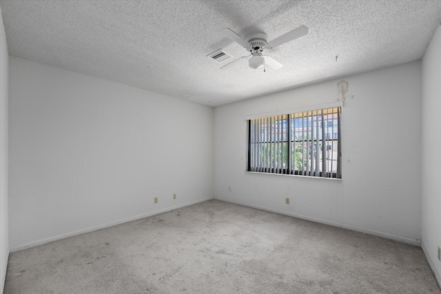 unfurnished room featuring carpet flooring, a textured ceiling, and ceiling fan