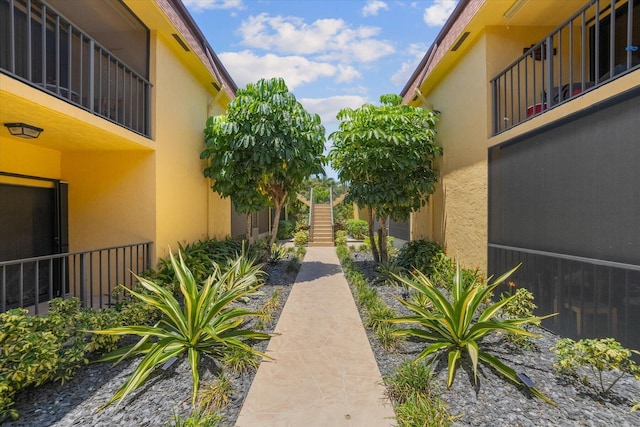 view of community featuring stairs