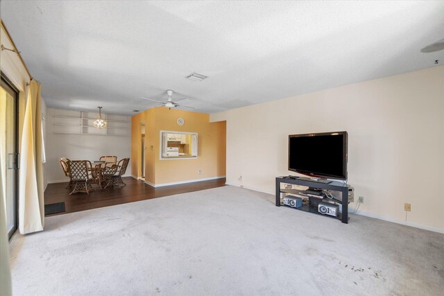 living room with ceiling fan and wood-type flooring