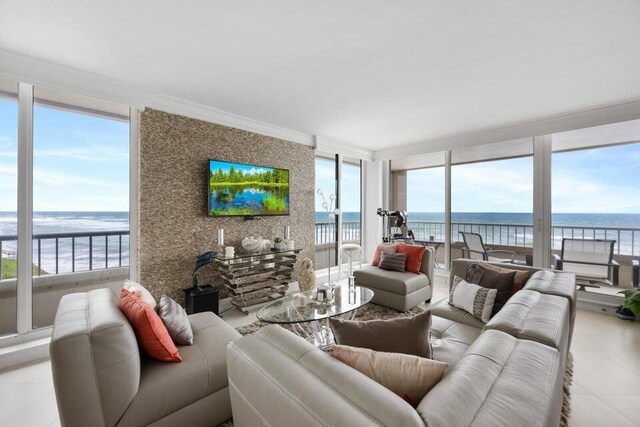 living room with a wealth of natural light and light tile patterned floors