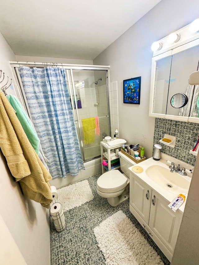 full bathroom featuring tile patterned floors, toilet, tasteful backsplash, shower / bath combination with glass door, and vanity