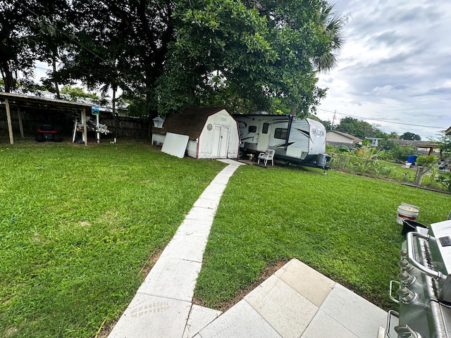 view of yard with a storage unit